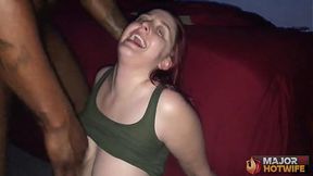 Curvy redhead Andi Ray deepthroats massive cock