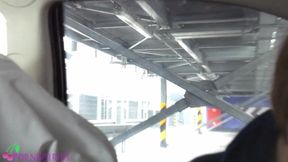Receiving feetjob on car parking