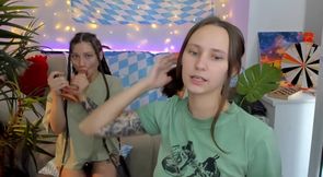 Naked lesbian girlfriends suck dildos together