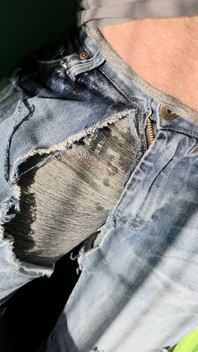 Hammock wetting in gray leggings under tattered jeans