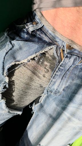 Hammock wetting in gray leggings under tattered jeans