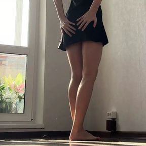 Beautiful leggy barefoot girl changing her panties