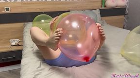 Fitgirl with a beautiful ass does yoga with her trainer and balloons
