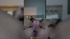 Women's Clit Gets Stretched and Clamped While Butt Plug Expands Her