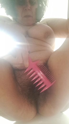 combing the hairy pussy of a milf