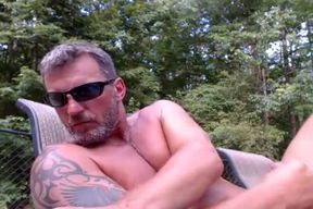 mature stud jerks off by pool on cam