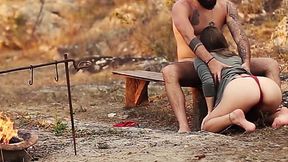 Risky babe fucks with guy by the campfire