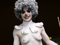 A clown dressed babe teasing amateur style