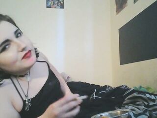 emo cutie smokes a cigarette, positions, and shows her feet