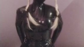 Amateur crossdresser rubberdoll playing with a big dildo