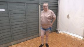 MILF stripping in shorts