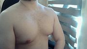 Muscular stud plays with his nipples and muscles