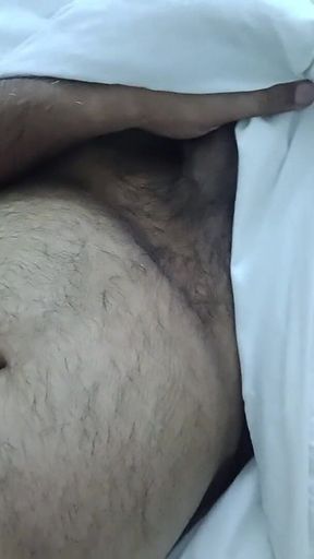 Indian Daddy Lying on the Bed Teasing and Posing for You