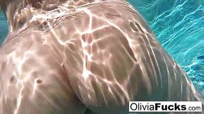 Wealthy blonde woman, Olivia Austin is rubbing her perfectly shaved pussy in the swimming pool
