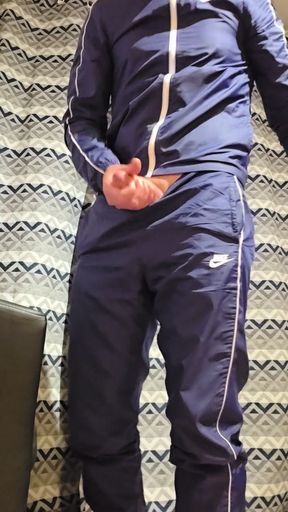 Handjob tracksuit nike in front of a porn movie