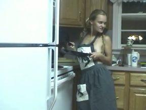 Just a horny and skinny blondie in the kitchen playing