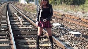 Dirty black haired teen is gonna show hard solo on rail track