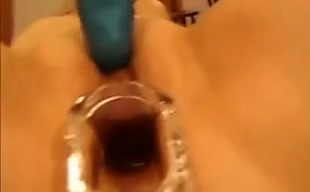 Horny chick gets a speculum in her tight twat and demonstrates all she got