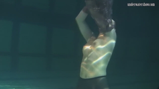 Dressed underwater beauty Bulava Lozhkova swimming naked