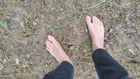 Walking barefoot in the garden and showing my dirty soles (avi)