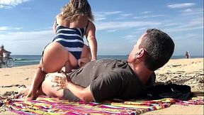 Amateur milf takes his dick in her ass on a public beach