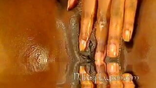 Nilou Achtland fingers her wet pussy
