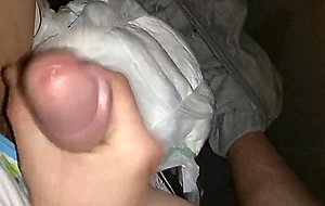 Twink cumming his wet diaper