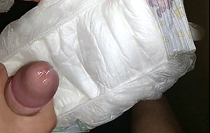 Twink cumming his wet diaper