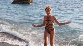 Sofi_ Swimming in the bay of Aphrodite in a harness of black ropes_ Cyp