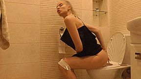 Toilet sexy blondie in a black short dress! MP4