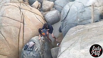 Amateur brunette is moaning while getting her pussy licked by a stranger, on the beach