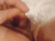 Young fat guy takes a shower and massages his dick with a shower