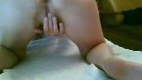 Just bends over and stretches her pussy to show on webcam