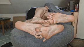 Feet In A Clinch On The Couch