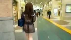 Cute japanese babe with handsome ass is walking outdoors