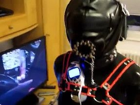 Rubber Gimp in the pillory