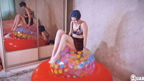 Q689 Stasia pumps 48'' beach ball under her to pop - 480p