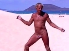 Tanned guy on beach in tiny string thong (temporarily!)