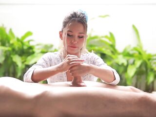 A tiny Oriental woman massages a large ramrod