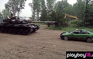 Big boobed badass nude babes Taylor Seinturier and Nadia Moore driving tank
