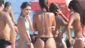 Young amateur babes with big asses in thongs on public beach