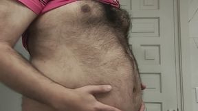 The big bear showing and playing with his huge belly