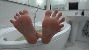 Damp and wrinkled feet after a bath c
