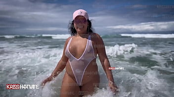 Kriss ON A PUBLIC BEACH WEARING A CLEAR BIKINI