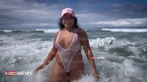 Kriss ON A PUBLIC BEACH WEARING A CLEAR BIKINI