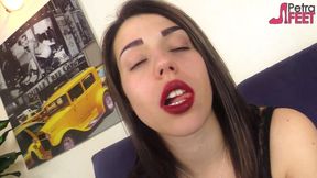 Beautiful Italian girl is smoking a cigar in close up