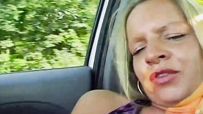 A horny blonde girl from Germany sucking a loaded pecker in the car