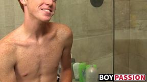 Redhead twink Alan Parish masturbates and cums under shower