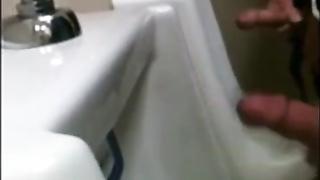 two slim dicks getting wanked at the urinals 3