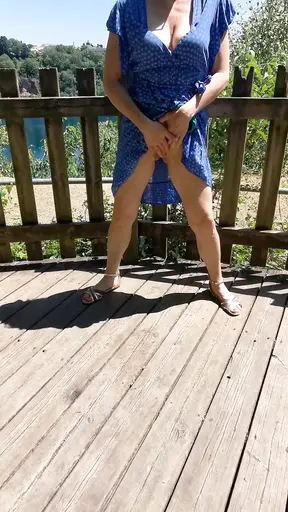 Sexy MILF pees in public park, shows her ass and boobs